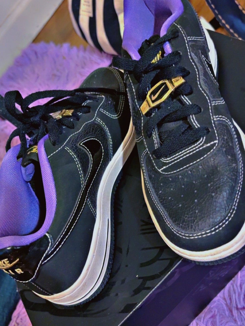 Nike Wonen’s Black Sneakers with Purple Lining and Gold Eyelets